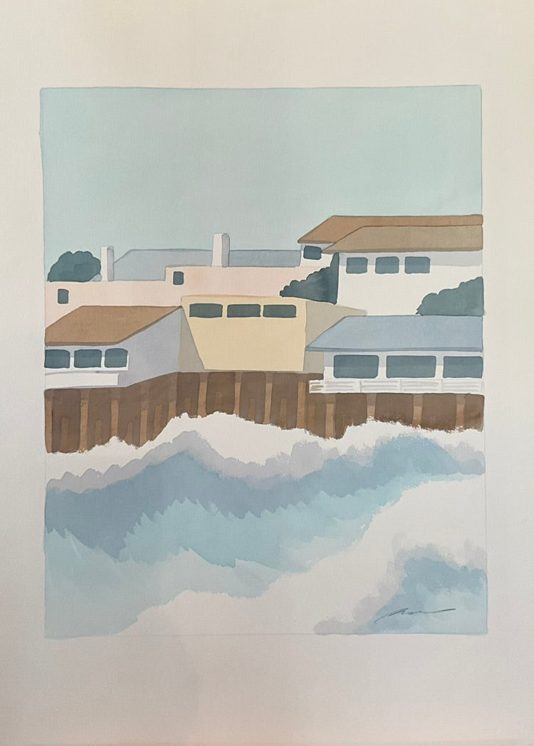 A watercolor painting depicting a seaside scene with houses and a body of water.