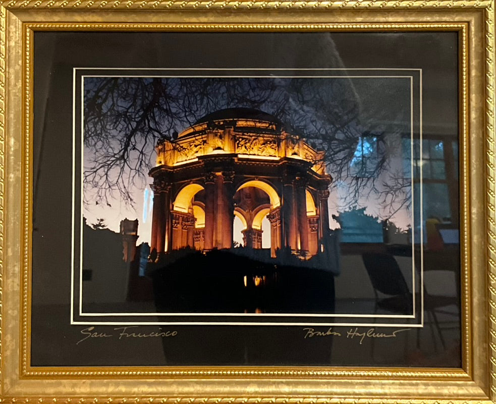 Framed artwork featuring a building at dusk with a gold frame, presumably the San Francisco building mentioned in the title.