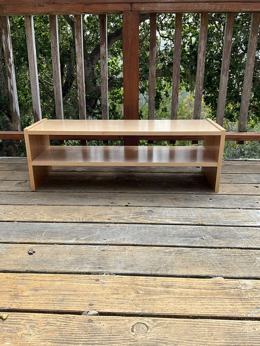 Clear stained wooden storage shelf
