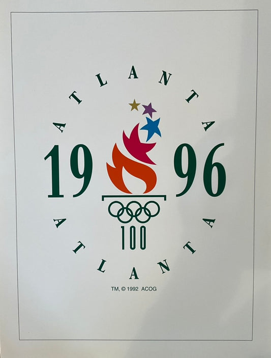 A commemorative Olympic poster for the 1996 Atlanta Games, featuring the Olympic rings and the year 1996.
unframed